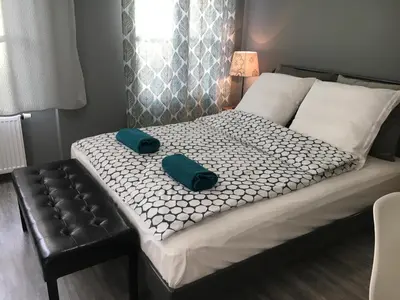 Łóżko lub łóżka w pokoju w obiekcie Apartament Easy Stay Center