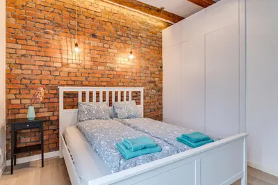 Łóżko lub łóżka w pokoju w obiekcie Apartament Z Widokiem Na Rynek