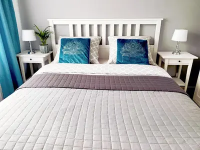 Łóżko lub łóżka w pokoju w obiekcie Apartament na Tęczowej