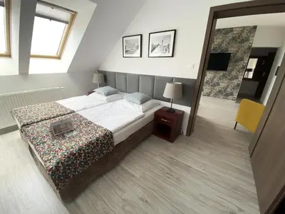 Łóżko lub łóżka w pokoju w obiekcie Hotel Srebrna Góra