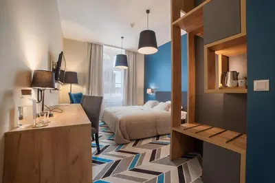 Łóżko lub łóżka w pokoju w obiekcie Hotel Traffic Wrocław Stare Miasto