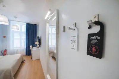 Łóżko lub łóżka w pokoju w obiekcie Hotel Traffic Wrocław Stare Miasto