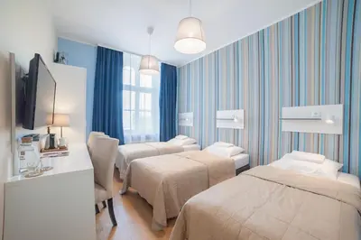 Łóżko lub łóżka w pokoju w obiekcie Hotel Traffic Wrocław Stare Miasto