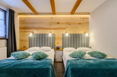 Łóżko lub łóżka w pokoju w obiekcie Vital&Spa Resort Szarotka