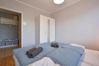 Łóżko lub łóżka w pokoju w obiekcie Apartament Dzień dobry