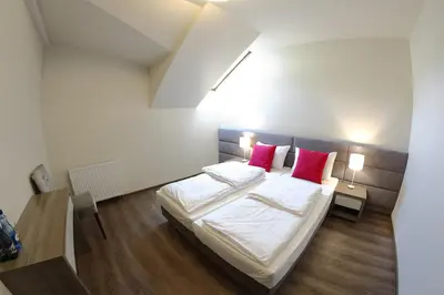 Łóżko lub łóżka w pokoju w obiekcie Malinowy Dwór Wieluń