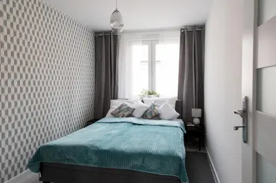Łóżko lub łóżka w pokoju w obiekcie Legnica Apartament 52m2 Delux 1