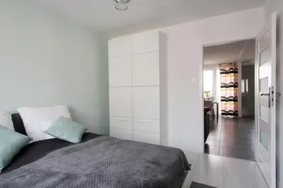 Łóżko lub łóżka w pokoju w obiekcie Legnica Apartament 52m2 Delux 1