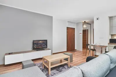 Telewizja i/lub zestaw kina domowego w obiekcie Exclusive Apartments Tęczowa with underground PARKING by Noclegi Renters