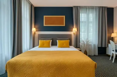 Łóżko lub łóżka w pokoju w obiekcie Hotel Villa Art Novis Wrocław Centrum