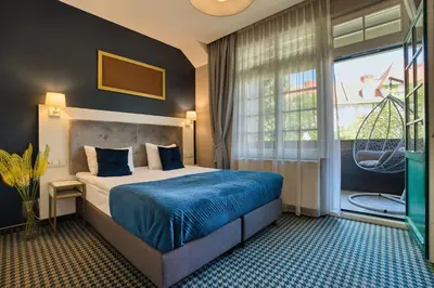 Łóżko lub łóżka w pokoju w obiekcie Hotel Villa Art Novis Wrocław Centrum