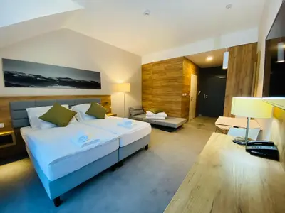 Łóżko lub łóżka w pokoju w obiekcie Apartamenty Czarna Góra Veraneo