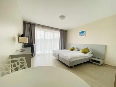 Łóżko lub łóżka w pokoju w obiekcie Apartamenty Czarna Góra Veraneo
