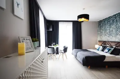 Łóżko lub łóżka w pokoju w obiekcie Apartamenty Biała Sowa Czarna Góra