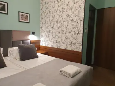 Łóżko lub łóżka w pokoju w obiekcie Chata nad Sztolnią