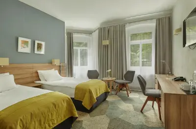 Łóżko lub łóżka w pokoju w obiekcie Impresja Art Resort