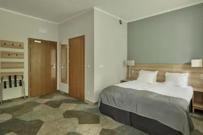 Łóżko lub łóżka w pokoju w obiekcie Impresja Art Resort