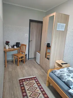 Łóżko lub łóżka w pokoju w obiekcie Dom Wycieczkowy 