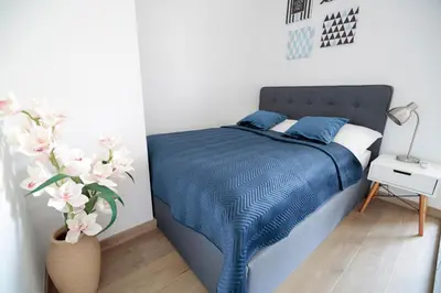 Łóżko lub łóżka w pokoju w obiekcie ApArt Bulwary Wrocław