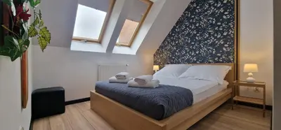 Łóżko lub łóżka w pokoju w obiekcie Lux Apartment Duplex