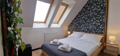 Łóżko lub łóżka w pokoju w obiekcie Lux Apartment Duplex