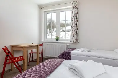 Łóżko lub łóżka w pokoju w obiekcie Róża Sudetów