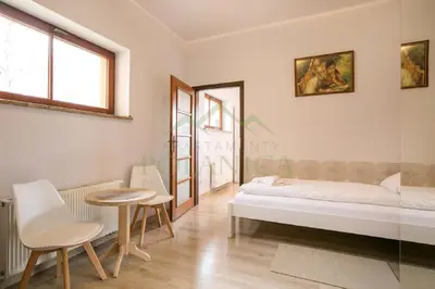 Łóżko lub łóżka w pokoju w obiekcie Parkowa Polana - PolanicaApartamenty