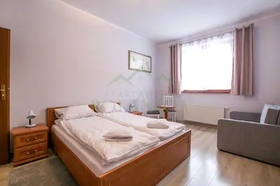 Łóżko lub łóżka w pokoju w obiekcie Parkowa Polana - PolanicaApartamenty