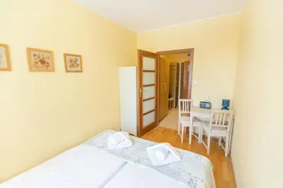 Łóżko lub łóżka w pokoju w obiekcie Parkowa Polana - PolanicaApartamenty