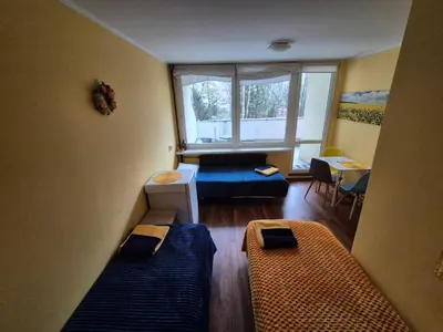 Łóżko lub łóżka w pokoju w obiekcie Travel House Wroclaw