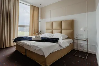 Łóżko lub łóżka w pokoju w obiekcie Aroma Stone Hotel Spa