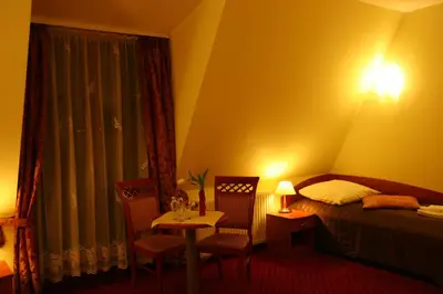 Łóżko lub łóżka w pokoju w obiekcie Hotel Karolinka