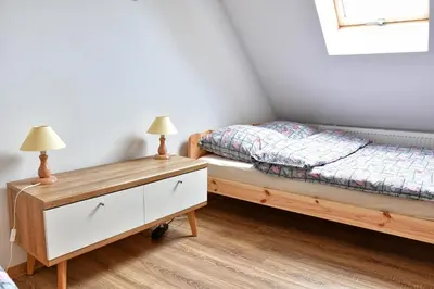 Łóżko lub łóżka w pokoju w obiekcie Agroturystyka Trzy Siostry