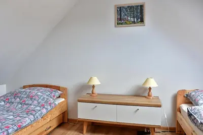Łóżko lub łóżka w pokoju w obiekcie Agroturystyka Trzy Siostry