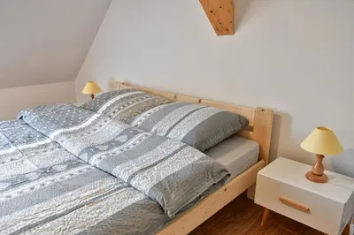 Łóżko lub łóżka w pokoju w obiekcie Agroturystyka Trzy Siostry