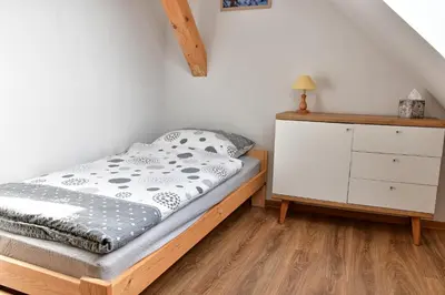 Łóżko lub łóżka w pokoju w obiekcie Agroturystyka Trzy Siostry