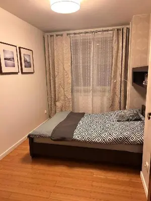 Łóżko lub łóżka w pokoju w obiekcie Apartament Bluszcz