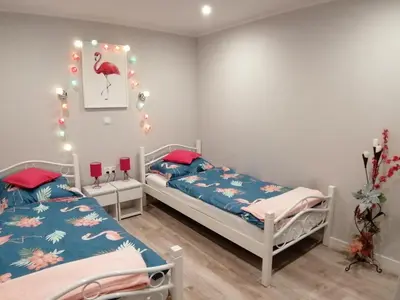 Łóżko lub łóżka w pokoju w obiekcie Apartament Grosik