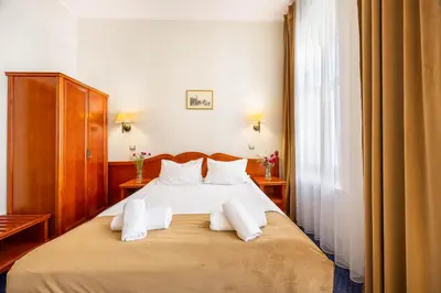Łóżko lub łóżka w pokoju w obiekcie Hotel Europejski Wrocław Centrum
