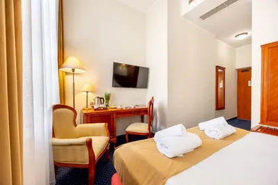 Łóżko lub łóżka w pokoju w obiekcie Hotel Europejski Wrocław Centrum