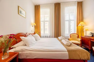 Łóżko lub łóżka w pokoju w obiekcie Hotel Europejski Wrocław Centrum