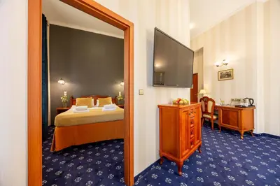 Łóżko lub łóżka w pokoju w obiekcie Hotel Europejski Wrocław Centrum