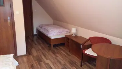 Łóżko lub łóżka w pokoju w obiekcie Na Skraju