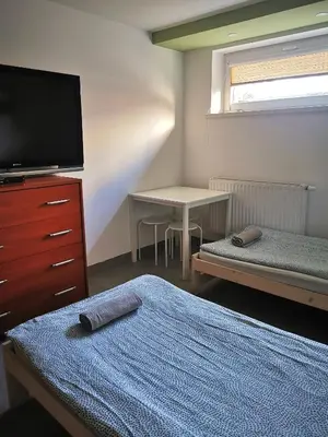Łóżko lub łóżka w pokoju w obiekcie Hostel 55 - darmowy parking