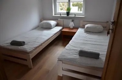 Łóżko lub łóżka w pokoju w obiekcie Hostel 55 - darmowy parking