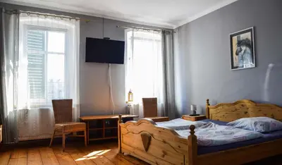 Łóżko lub łóżka w pokoju w obiekcie Stajnia na Warszawskiej