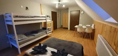 Łóżko lub łóżka w pokoju w obiekcie Pokoje Przy Polanie