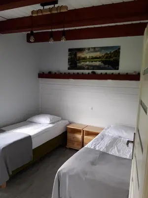 Łóżko lub łóżka w pokoju w obiekcie Apartament Fenowe Wzgórze