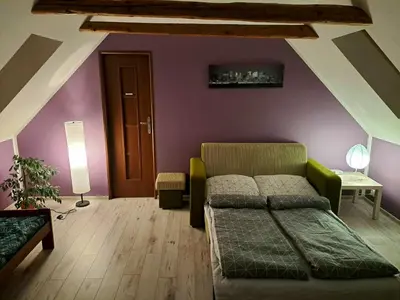 Łóżko lub łóżka w pokoju w obiekcie Apartament Zielony Zakątek