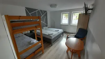 Łóżko lub łóżka w pokoju w obiekcie Apartament 